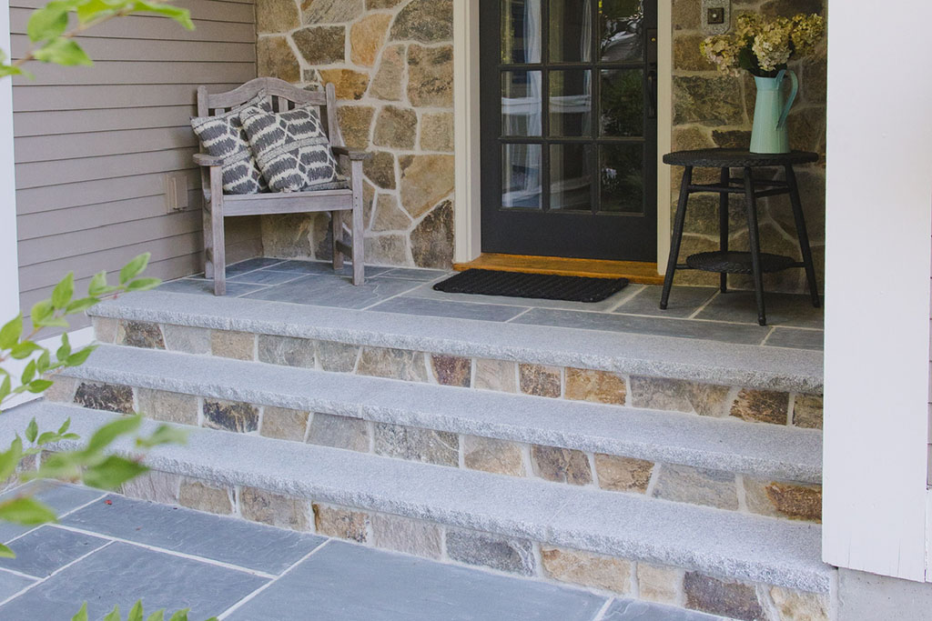 granite steps to a well appointed entryway